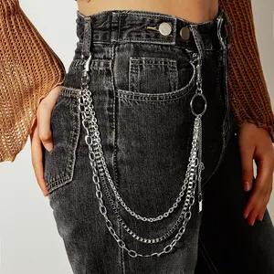 Close-up of triple-layered silver punk hip-hop waist chain with lock pendant on jeans