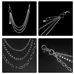 Macro detail of triple-layered punk metal pants chain with lock and key charms