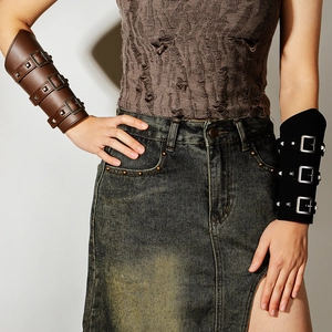 Close-up of steampunk PU leather bracer with adjustable metal buckles and square studs
