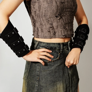 Detailed view of punk black faux leather arm guards with adjustable metal buckles and studs