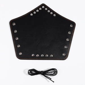 Detail of black leather medieval bracer with silver rivets and orange stitching