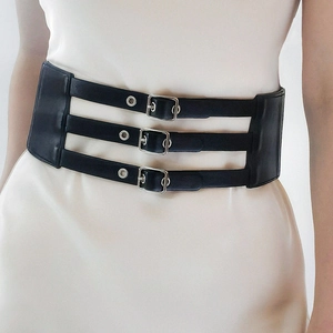 Women's vintage wide black elastic waist belt with triple silver buckle on dress
