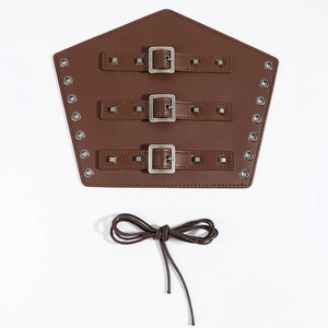 Detail of vintage brown faux leather gauntlet with metal buckles and square studs