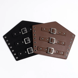 Detail of vintage PU leather wrist guards with adjustable metal buckles and studs
