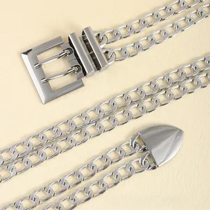 Close-up of a silver double-layered chain belt with square buckle and metal drop tip detail