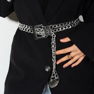 Detail of silver layered metal waist chain with heart pendant and rectangular buckle