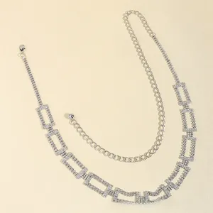 Detailed macro view of sparkling silver rhinestone waist chain with adjustable lobster clasp