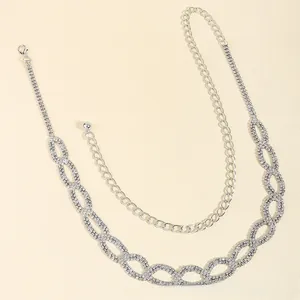 Detailed macro view of silver layered rhinestone waist chain with lobster clasp closure