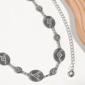 Detailed close-up of Bohemian retro silver waist chain with vintage sunburst carvings