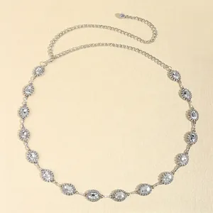 Elegant silver metal waist chain with sparkling oval crystals and adjustable link chain