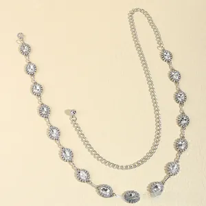 Close-up of silver rhinestone waist chain with oval crystal links and lobster clasp