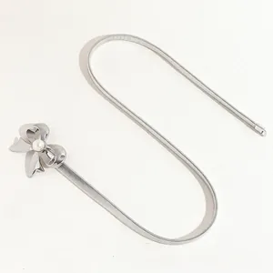Silver elastic metal waist chain for women with a pearl bow buckle and sleek snake chain