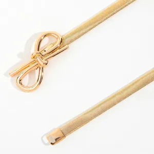Elegant gold elastic metal waist chain with a polished bow buckle for dresses and suits