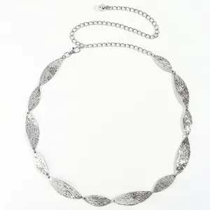 Close-up of silver metal leaf waist chain with hammered texture and adjustable clasp