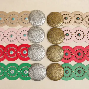 Western style leather belts with turquoise circular metal buckles and eyelet details