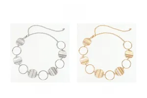 Detail of vintage hollow disc metal waist chain available in silver and gold finishes