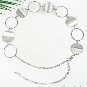 Close-up of silver metal waist chain featuring brushed hollow discs and lobster clasp