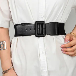 Close-up of black elastic wide waist belt with matte leather square buckle on white shirt