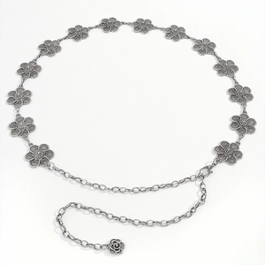 Detail of vintage silver metal waist chain with hollow flower links and lobster clasp