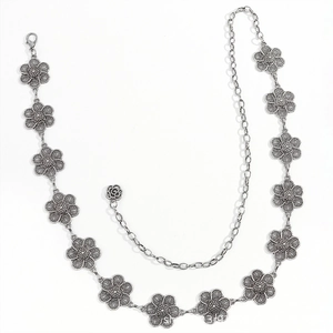 Detail of silver floral metal waist chain with lobster clasp and rose pendant