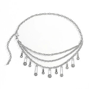 Detailed view of vintage silver metal waist chain with layered tassels and coin charms