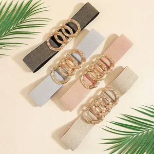 Women's elastic waist belts with triple-ring metal buckles in four metallic colors