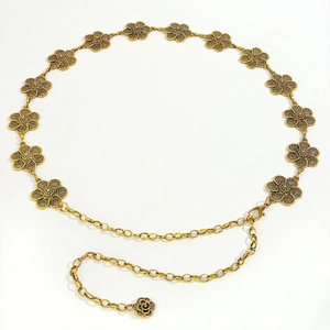 Close-up of vintage gold flower embossed metal chain belt with adjustable lobster clasp