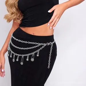 Detail of silver layered waist chain featuring vintage coin pendants and adjustable clasp