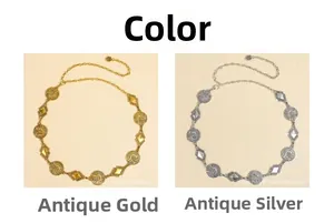 Detail of vintage bohemian waist chains in antique gold and silver with carved metal discs