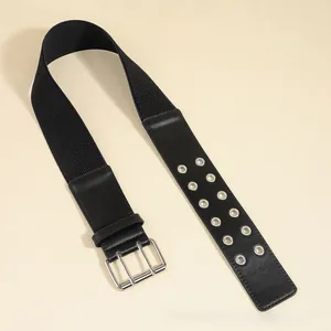 Detail of black wide elastic belt with silver double-pin buckle and dual metal eyelets