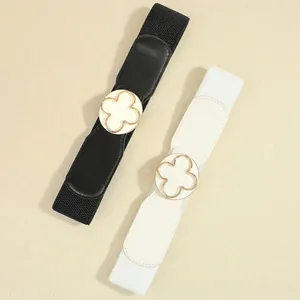 Elegant black and white elastic belts with clover buckles and gold metal hardware