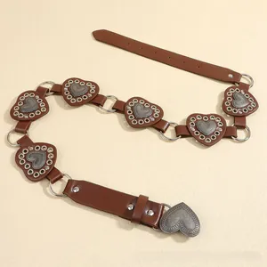 Detail of retro dark brown PU belt with silver metal heart rings and vintage heart buckle