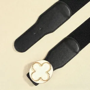 Elegant black elastic waist belt for women with a white clover metal buckle detail