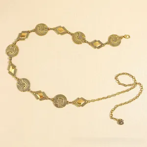 Detail of vintage gold bohemian waist chain featuring rose pendant and lobster clasp