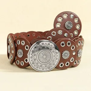 Detail showing vintage bohemian brown belt with silver sunflower studs and round buckle