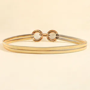 Close-up of golden spring chain belt with double round buckle and metal lock detail