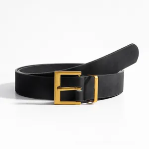 Detail of a black matte leather belt with a rectangular gold metal pin buckle