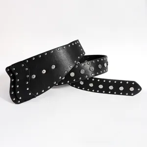Close-up of black punk leather belt featuring decorative silver metal rivets and stud detail