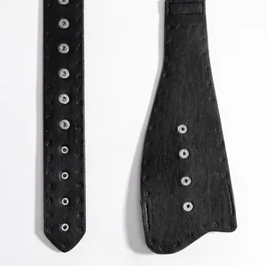 Punk style black leather belt with silver metal snap buttons and fine stitching details