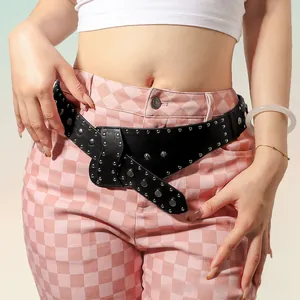 Detail of black punk leather belt with silver studs on checkered pants for street style
