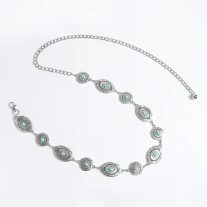 Detailed view of silver bohemian waist chain featuring turquoise inlays and metal engravings