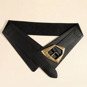 Women's black elastic wide waist belt with a vintage gold geometric buckle for dresses