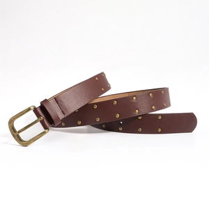 Vintage dark brown PU leather belt for women with brass studs and buckle on white background