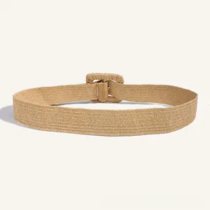 Detailed close-up of woven PP straw belt with square fabric-covered buckle in light khaki