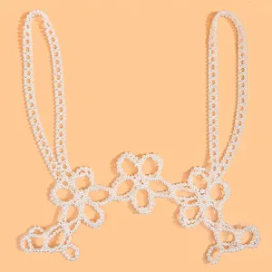 Exquisite pearl body chain featuring intricate five-petal flower motifs and beaded straps