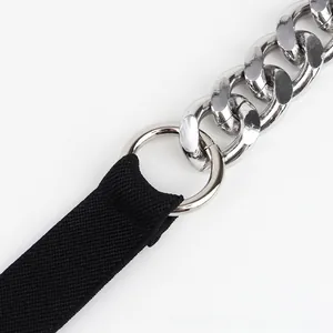 Close-up of polished silver metal chain linked with high-density black fabric belt