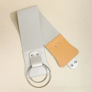 Detail of wide elastic corset belt with double metal rings and rivet leather patches