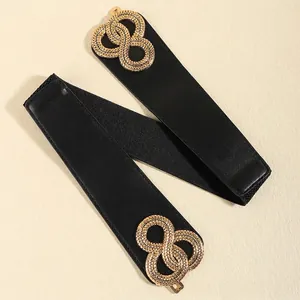 Ceinture large élastique noire pour femme avec boucle dorée en forme d'infini