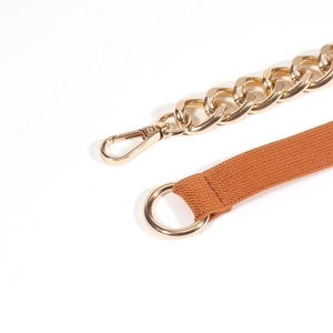 Detailed close-up of golden metal chain and brown elastic strap with lobster clasp
