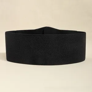 Detail of high-density black elastic wide belt with a minimalist design for dresses